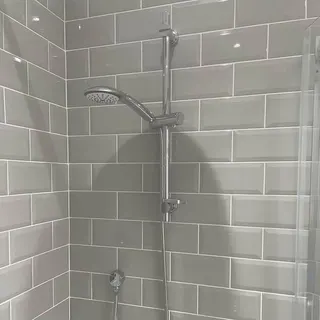 Shower enclosure with chrome fittings