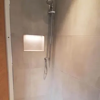 Bathroom shower area with tiled recess