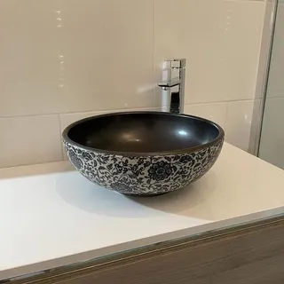 Bathroom sink with fitted cabinet
