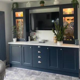 Kitchen fitting with cabinets and work surfaces